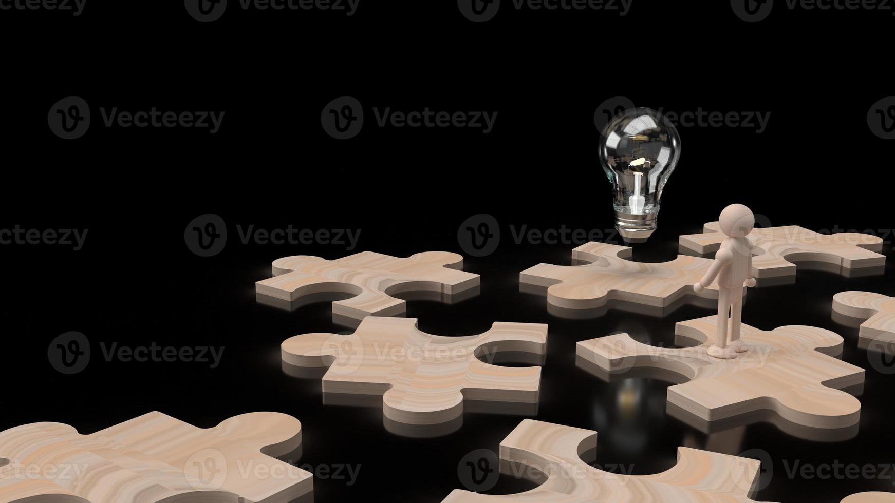 Die Glühbirne und die menschliche Figur aus Holz auf Puzzle 3D-Rendering. foto