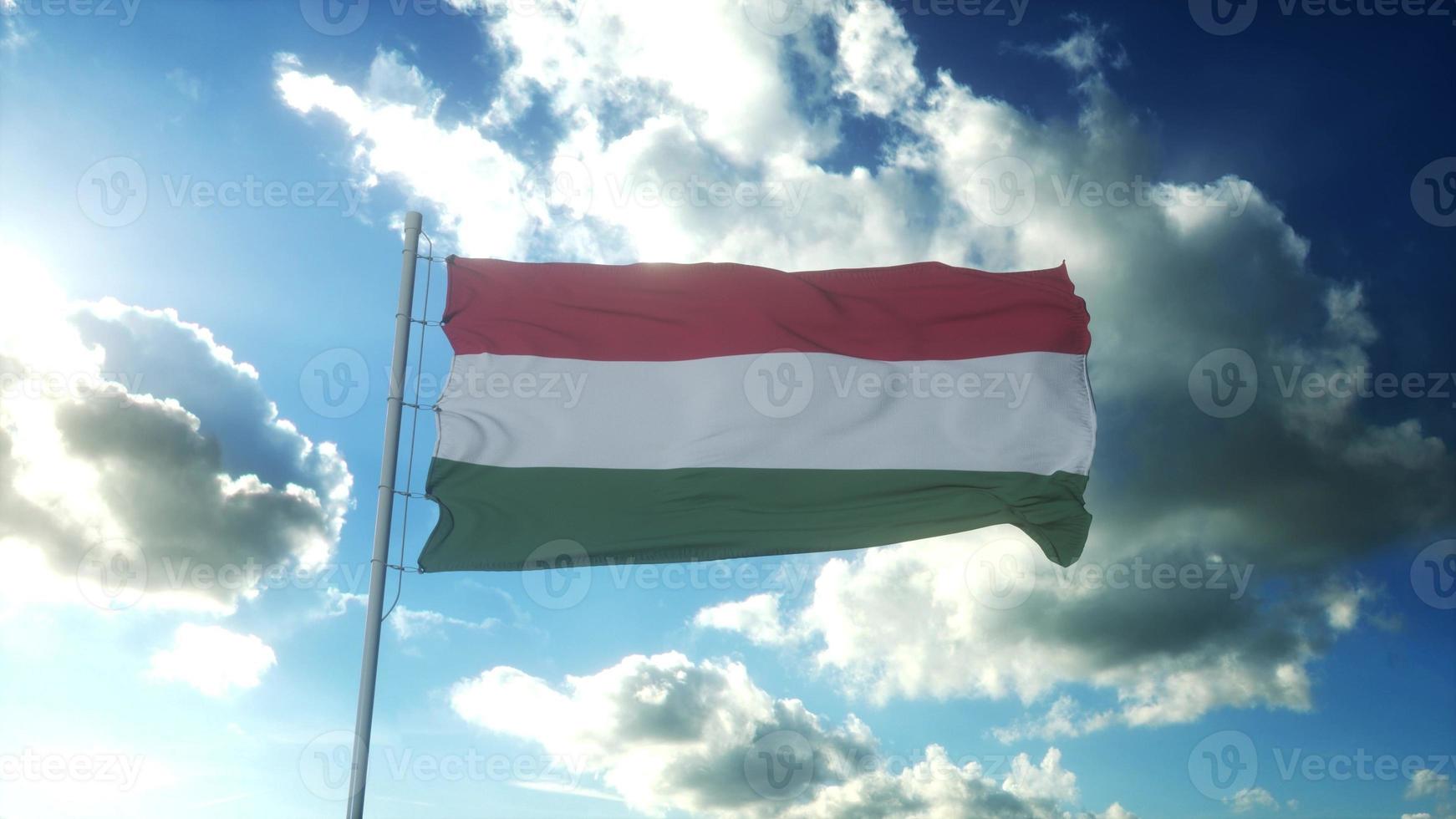 flagge von ungarn weht im wind gegen den schönen blauen himmel. 3D-Darstellung foto