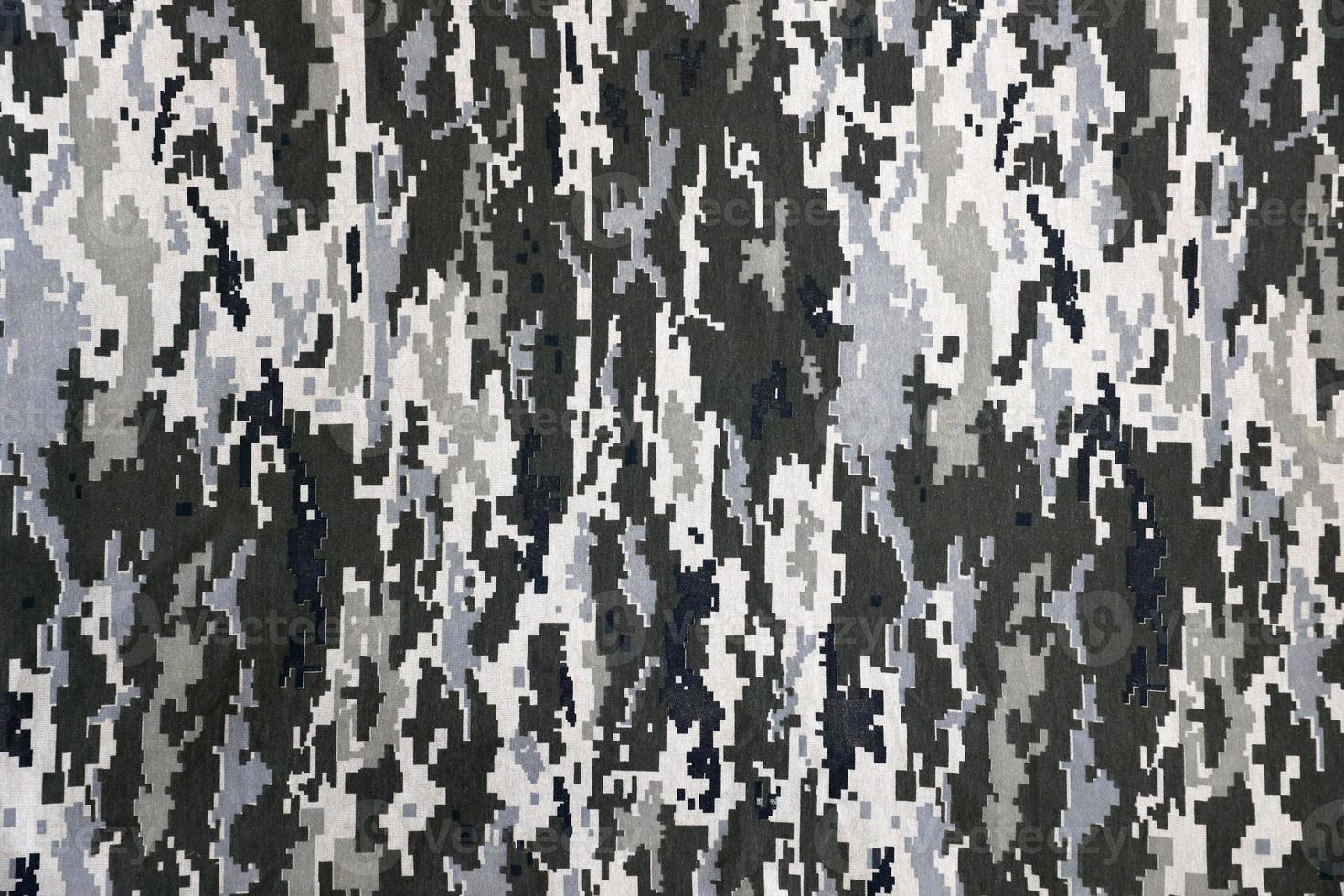 Stoff mit Textur der ukrainischen Militär-Pixeltarnung. Stoff mit Tarnmuster in grauen, braunen und grünen Pixelformen. offizielle uniform der ukrainischen soldaten foto