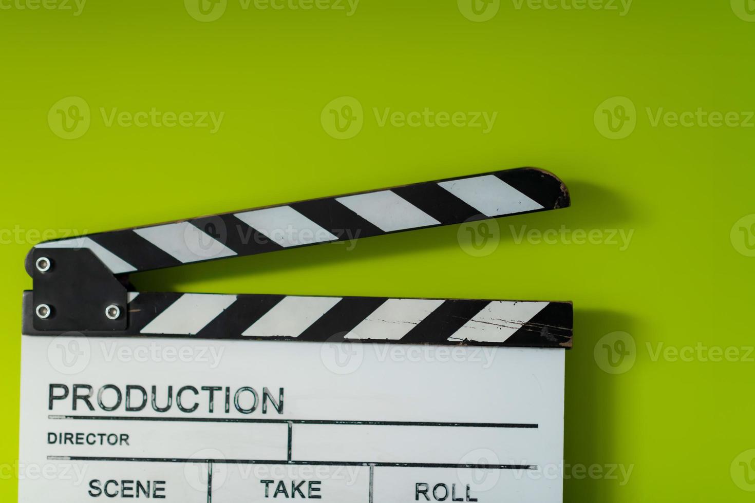 Filmklöppel auf grünem Hintergrund foto