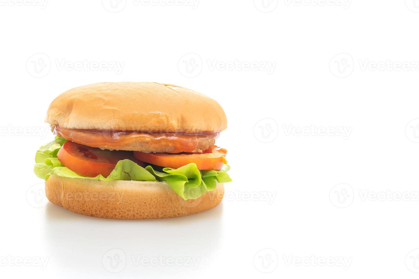 Chicken Burger mit Sauce auf weißem Hintergrund foto