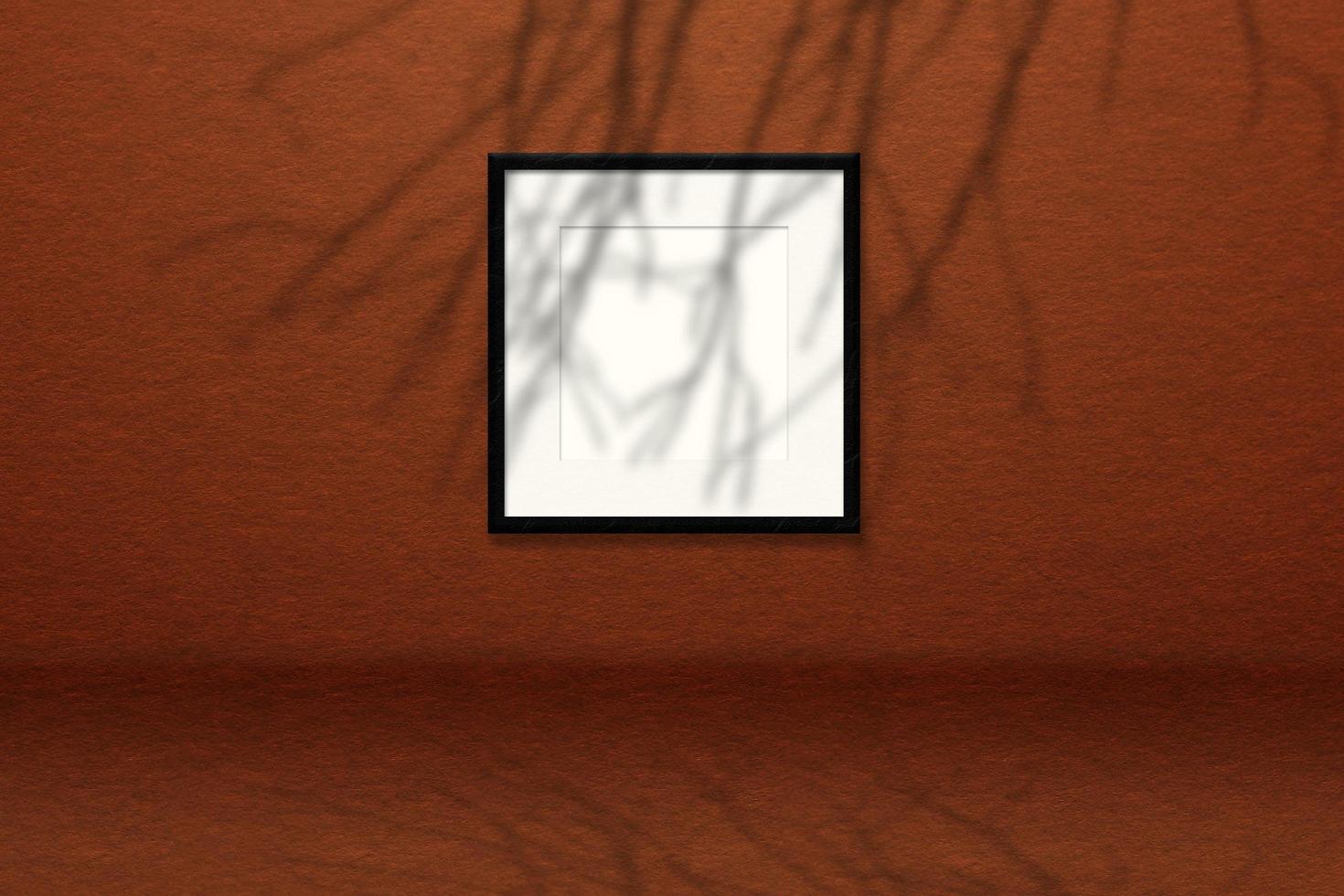 minimales leeres quadratisches weißes rahmenbild mock-up, das am wandhintergrund mit blattfenster hängt. foto