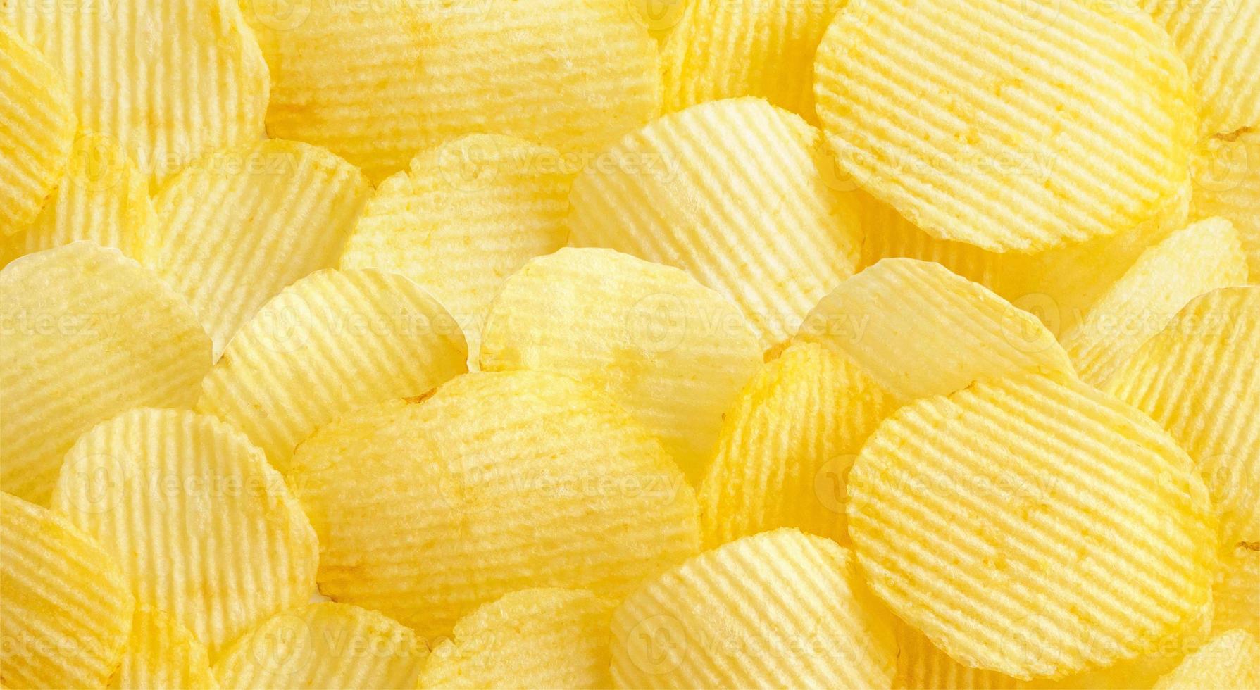 Knusprige Kartoffelchips Snack Textur Hintergrund foto