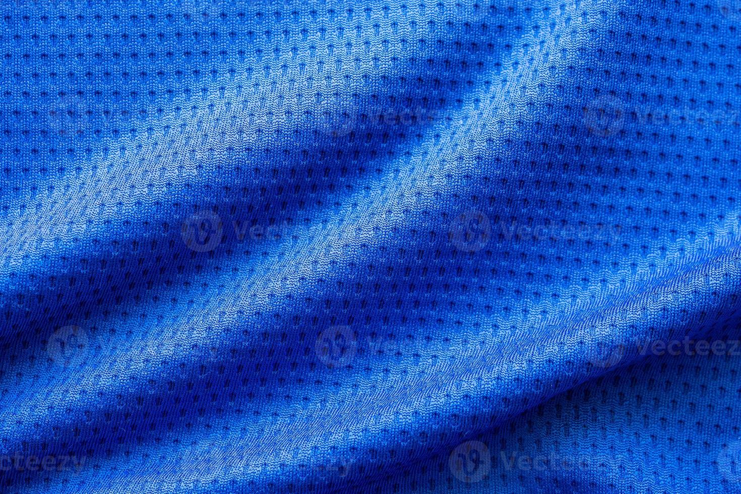 blauer stoff sportbekleidung fußball trikot mit air mesh textur hintergrund foto