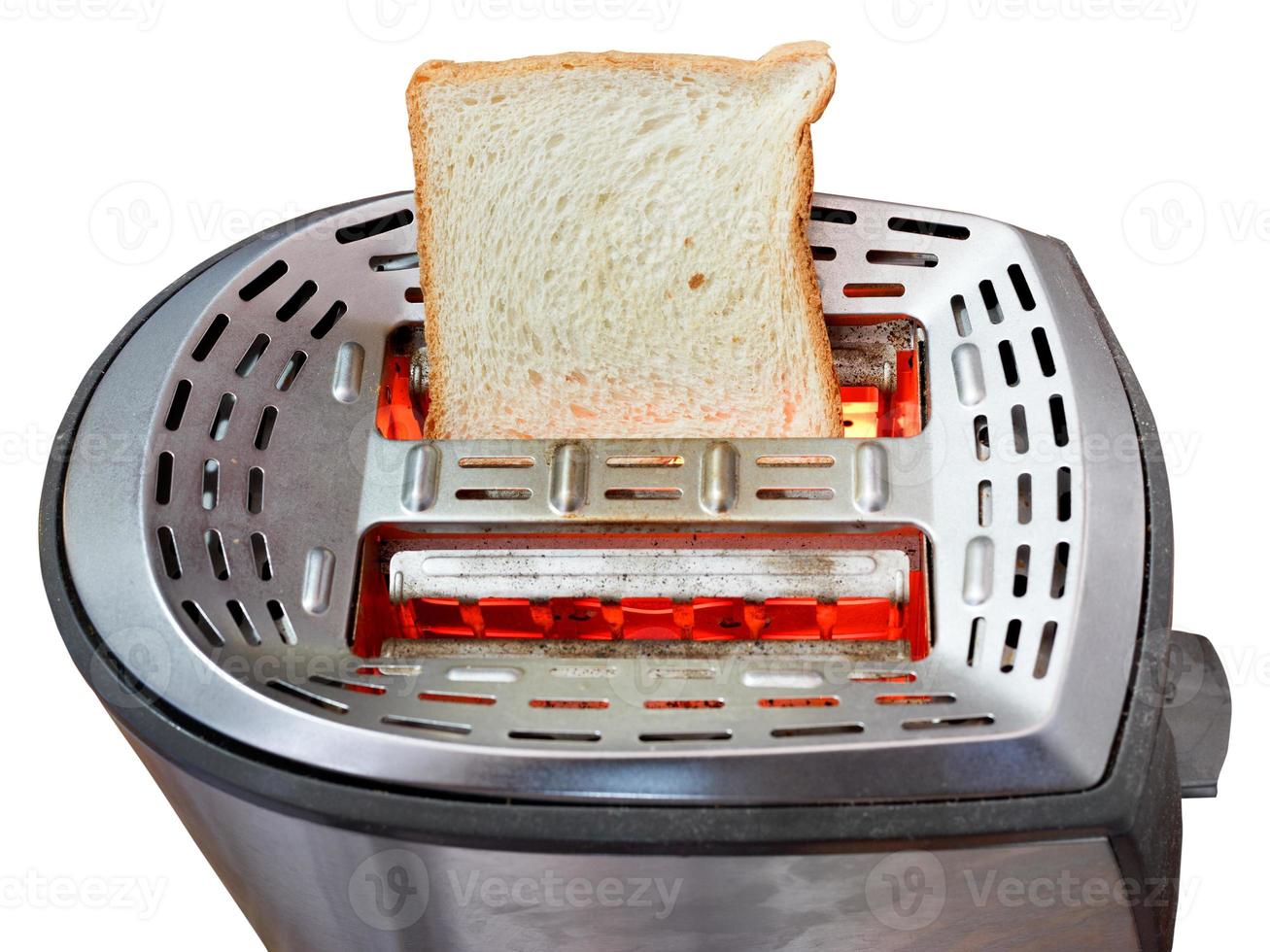 eine frische Scheibe Brot auf einem heißen Metalltoaster foto