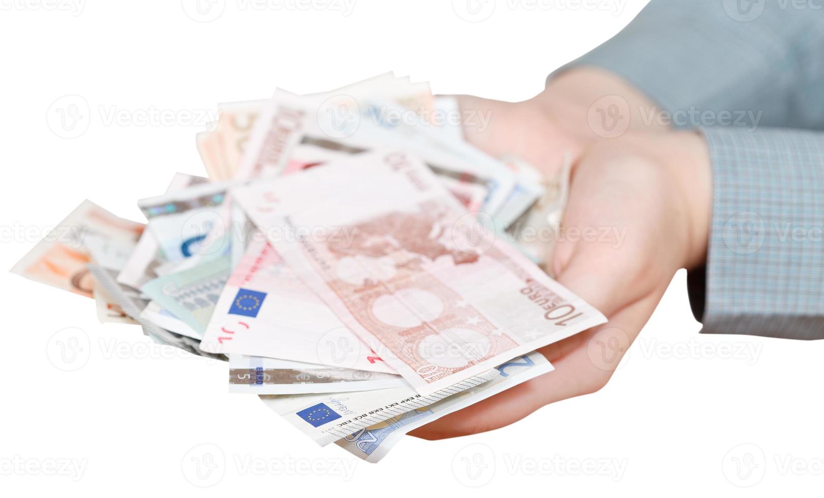 Viele Euro-Banknoten in schalenförmigen Palmen isoliert foto