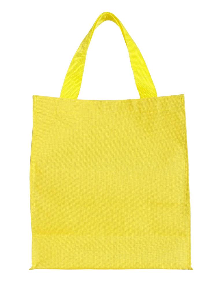 Gelbe Einkaufstasche aus Segeltuch isoliert auf weißem Hintergrund mit Beschneidungspfad foto