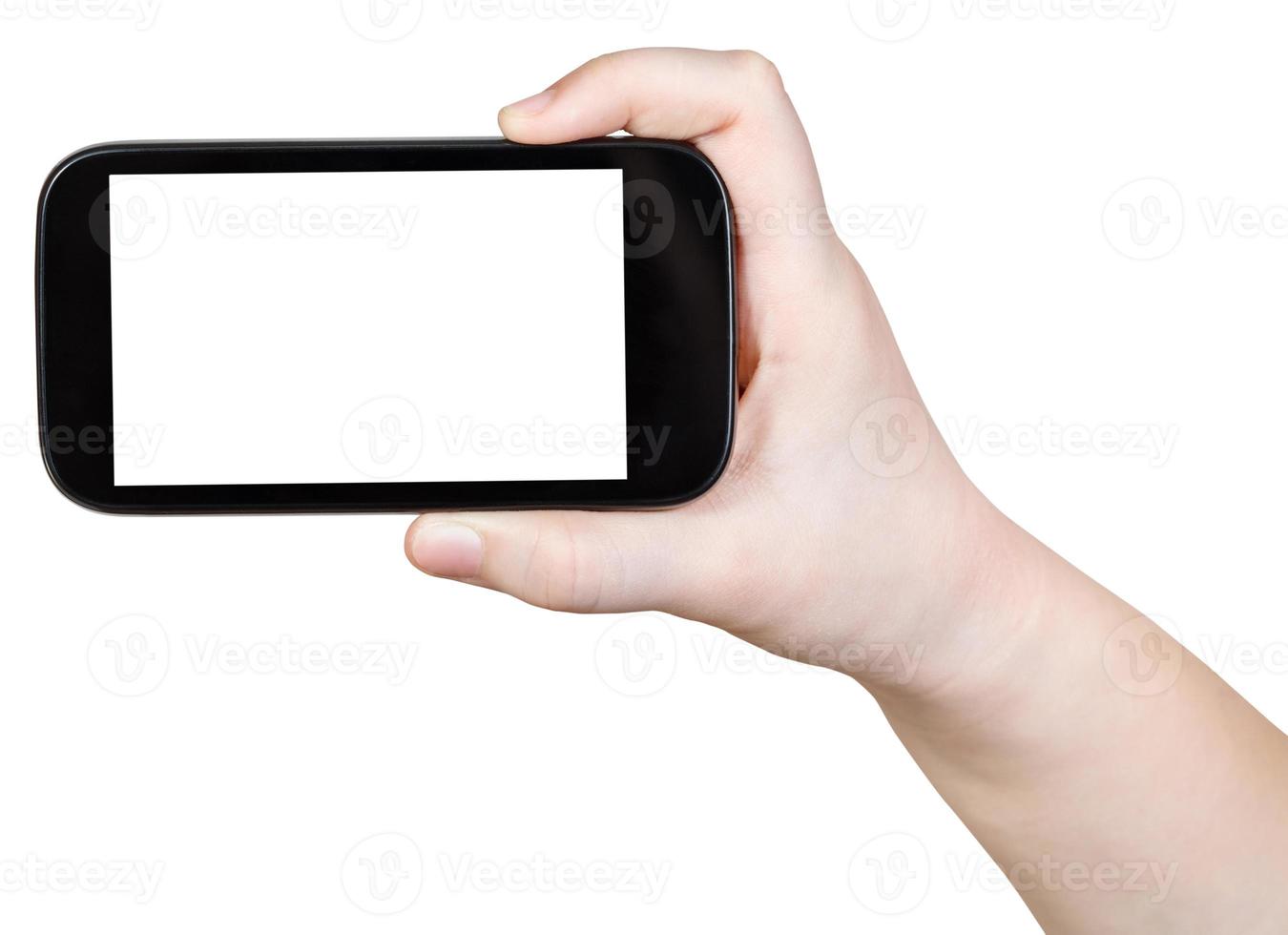 Kind hält Touchscreen-Telefon mit ausgeschnittenem Bildschirm foto