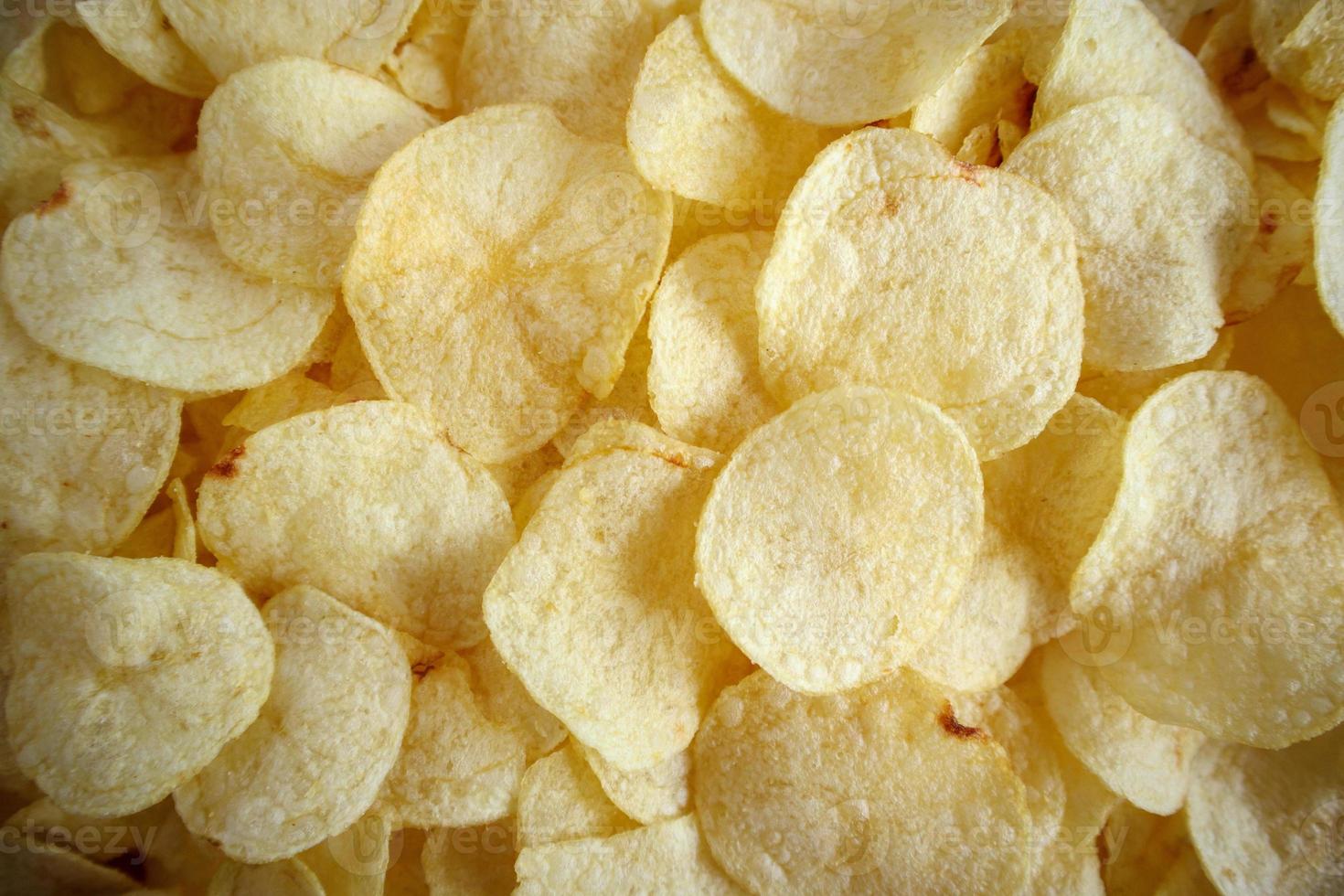 Knusprige Kartoffelchips Snack Textur Hintergrund foto
