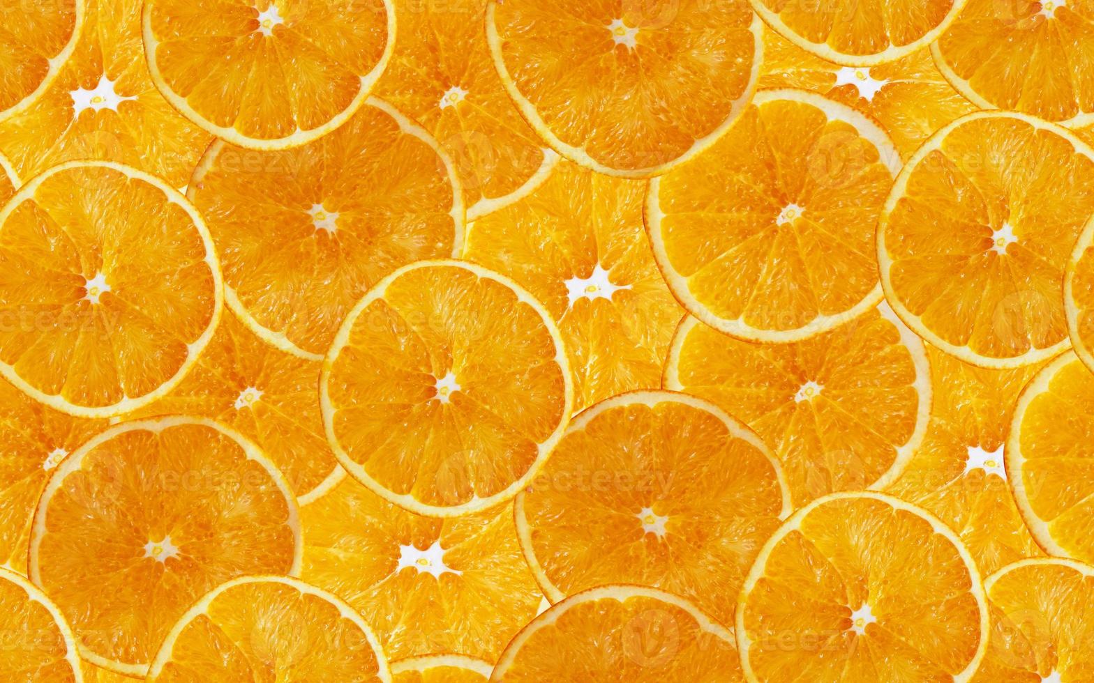 Orangenscheiben nahtloser Hintergrund. gelbe Zitrusfrüchte schneiden. foto