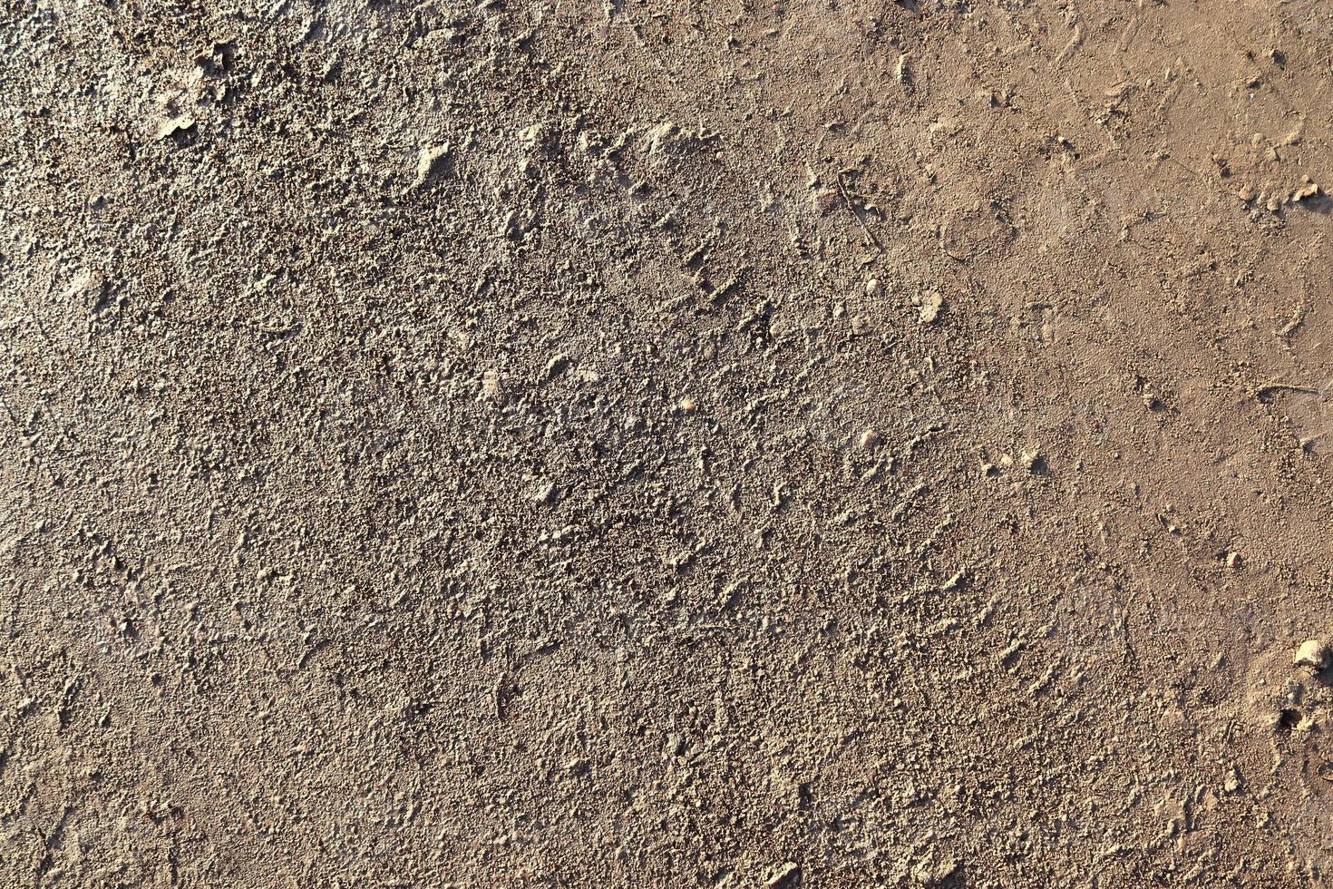 detaillierte nahaufnahme auf einer braunen sandgrundstruktur foto