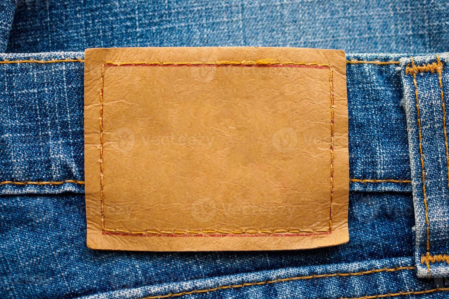blauer Denim-Jeans-Leder-Label-Textur-Hintergrund foto
