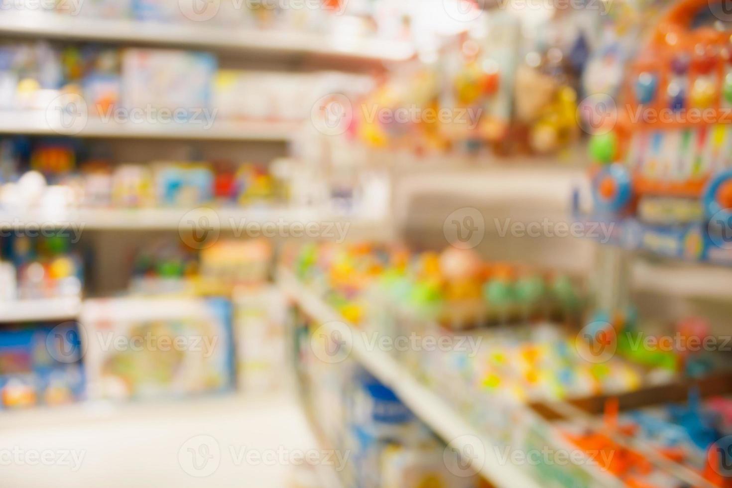 Kinderspielzeug für Baby-Kaufhaus im Einkaufszentrum Hintergrund verwischen foto