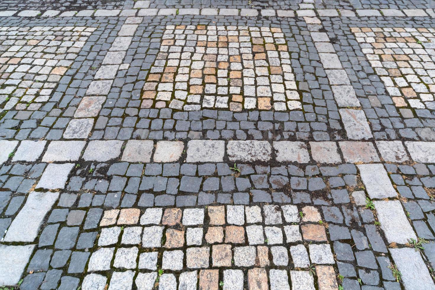 altes Pflastersteinmuster. Textur des alten deutschen Kopfsteinpflasters in der Innenstadt. kleine Granitfliesen. antike graue Gehwege. foto