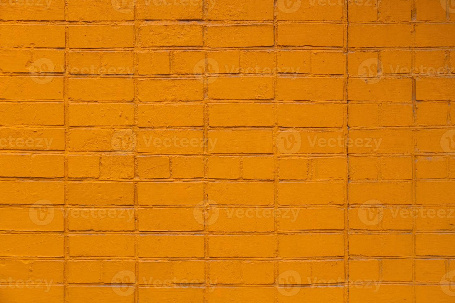 matt orange gestrichene Backsteinmauer Full Frame flacher Hintergrund und Textur foto