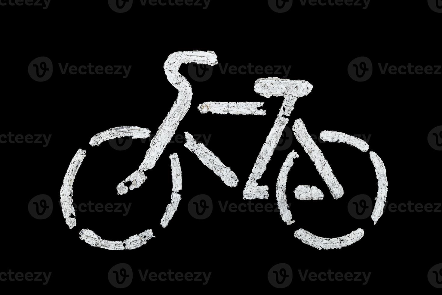 Fahrradschild auf Asphalt mit alter weißer Farbe - isoliert auf schwarzem Hintergrund foto