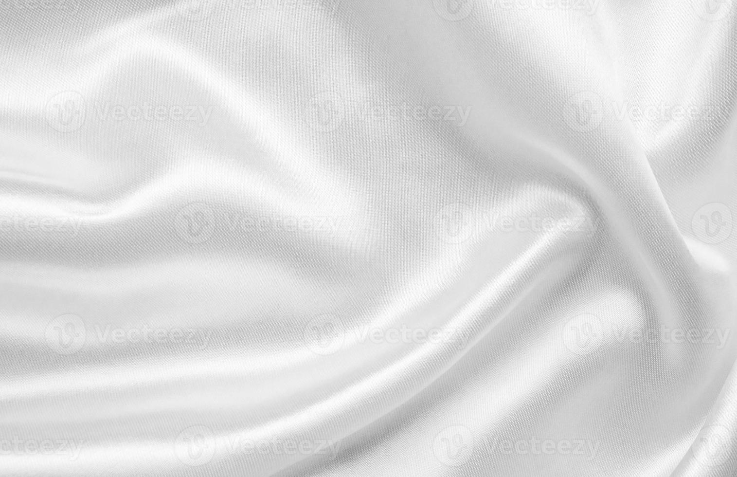 abstrakter weißer Stoff mit weichem Wellenstrukturhintergrund foto