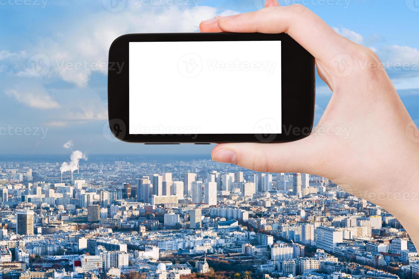 smartphone mit ausgeschnittenem bildschirm und pariser skyline foto