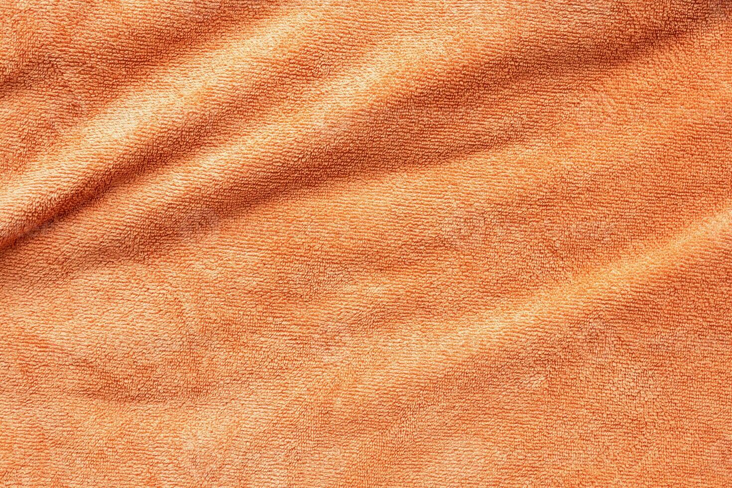 orange handtuch stoff textur oberfläche nah herauf hintergrund foto