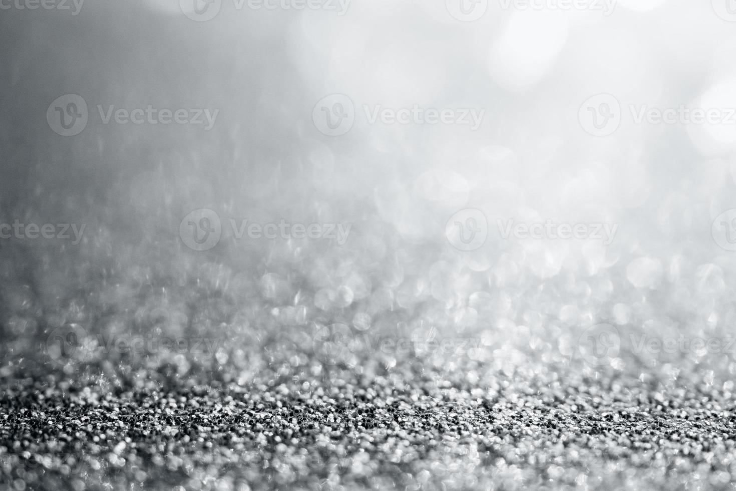 abstrakte silberne glitzernde Textur mit Bokeh-Hintergrund foto