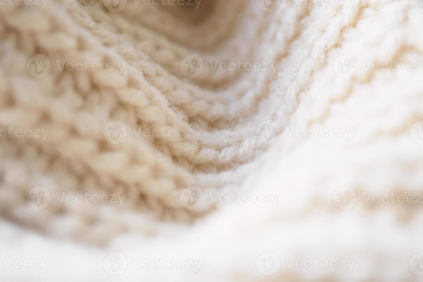 Nahaufnahme beige gestrickter Wollstoff Textur Hintergrund foto