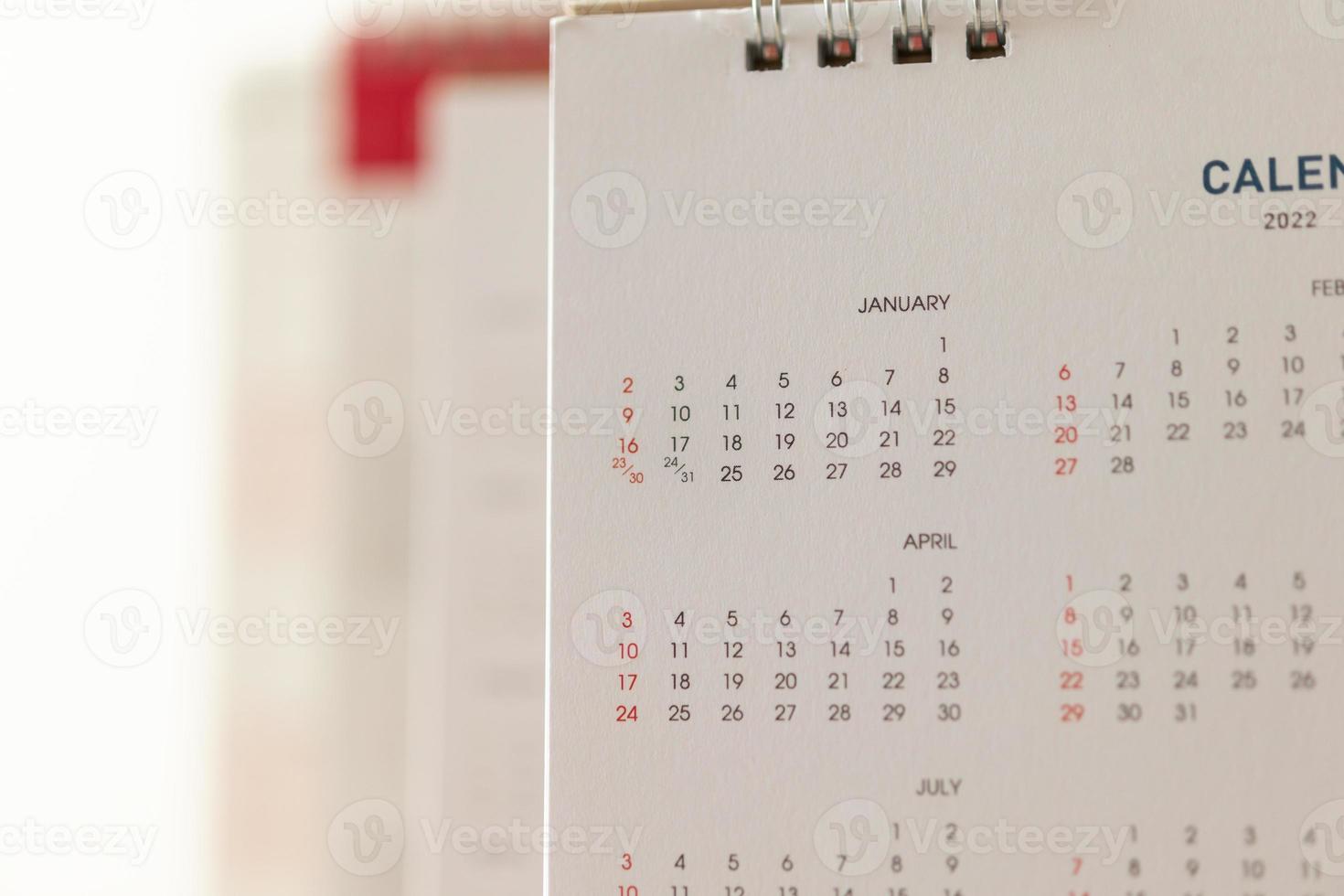 Schließen Sie herauf Kalenderseitendaten und Monatshintergrund Geschäftsplanungstermin-Besprechungskonzept foto