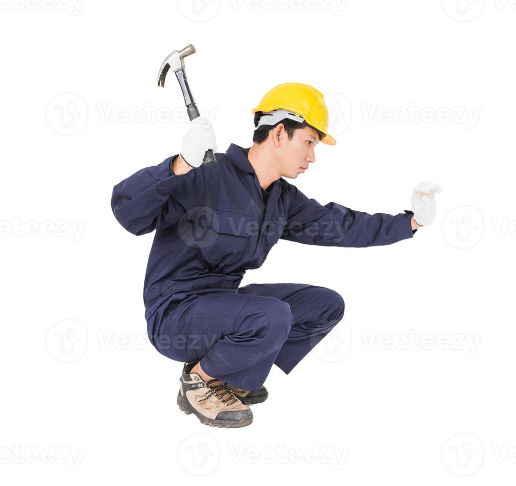 Handwerker in Uniform mit seinem Hammer foto