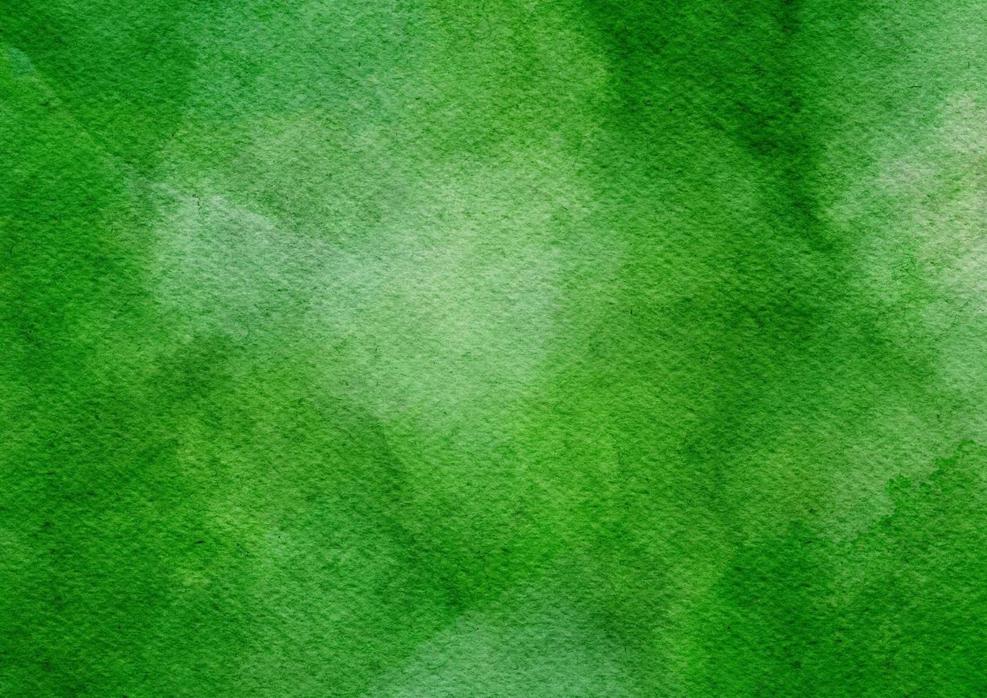 grüner aquarellschmerz auf papierbeschaffenheit, schöner hintergrund mit fleckaquarell foto