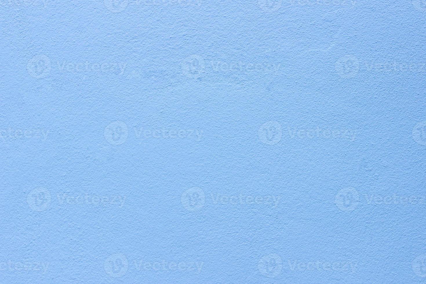 Hellblaue pastellfarbene Zementwand für Taxture und Hintergrund foto