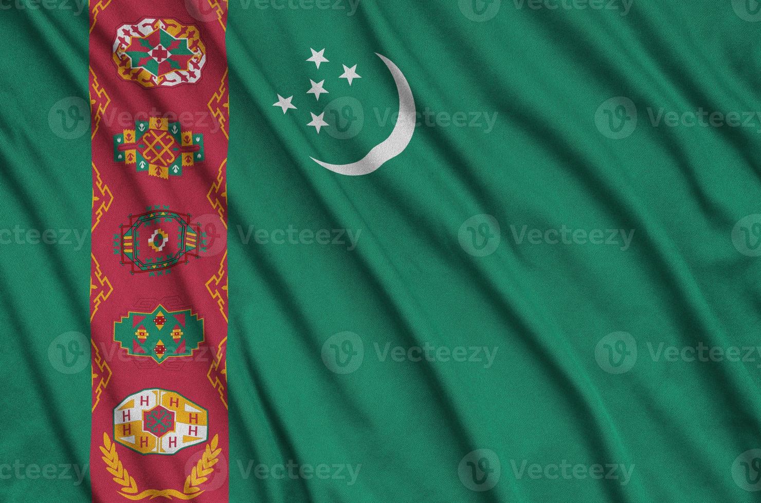 turkmenistan-flagge ist auf einem sportstoff mit vielen falten abgebildet. Sportteam-Banner foto