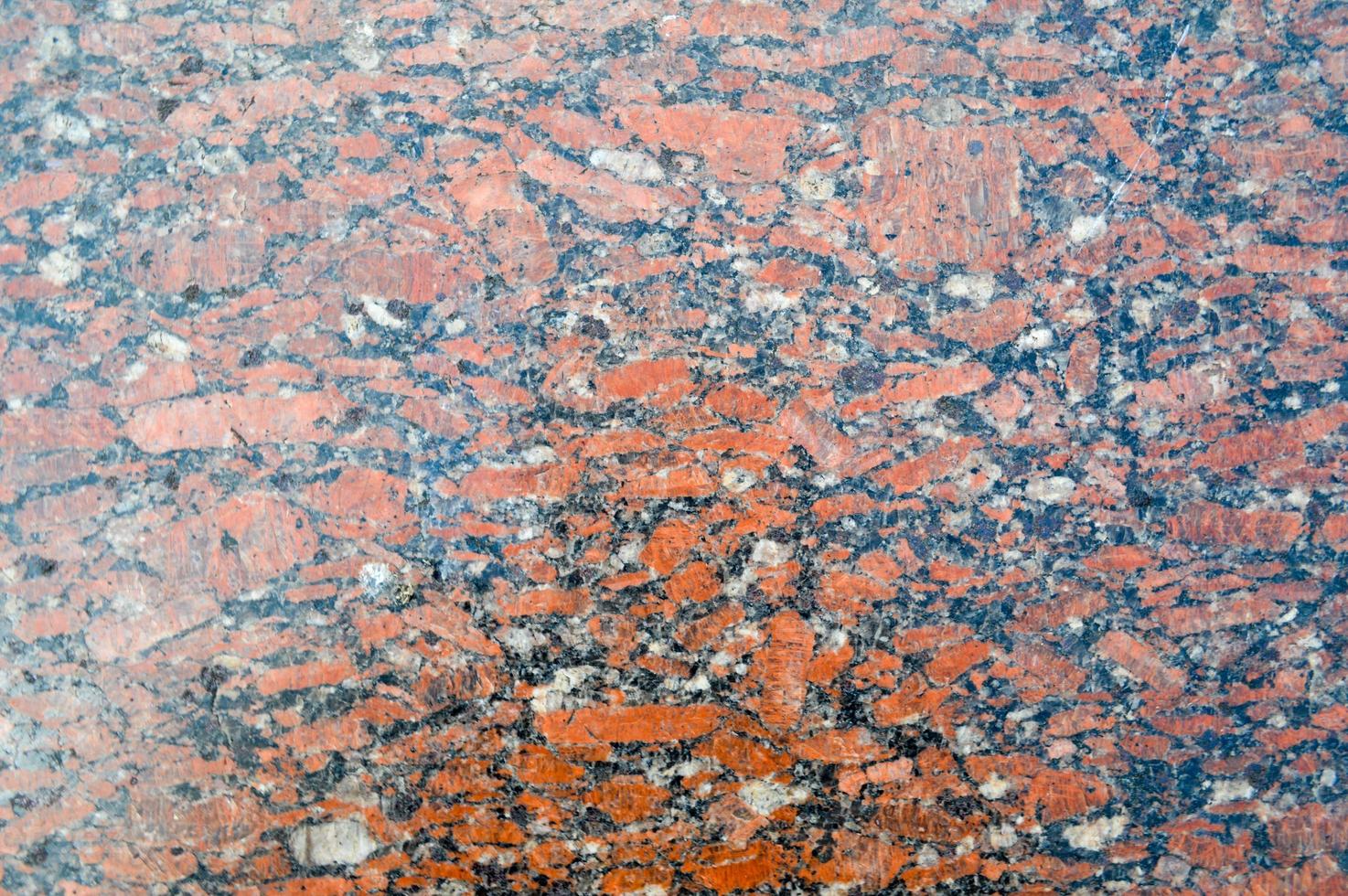 textur einer steinmauer teuer luxuriös starker glatter granit, marmorsplitter zweifarbig schwarz-braun durchsetzt. der Hintergrund foto