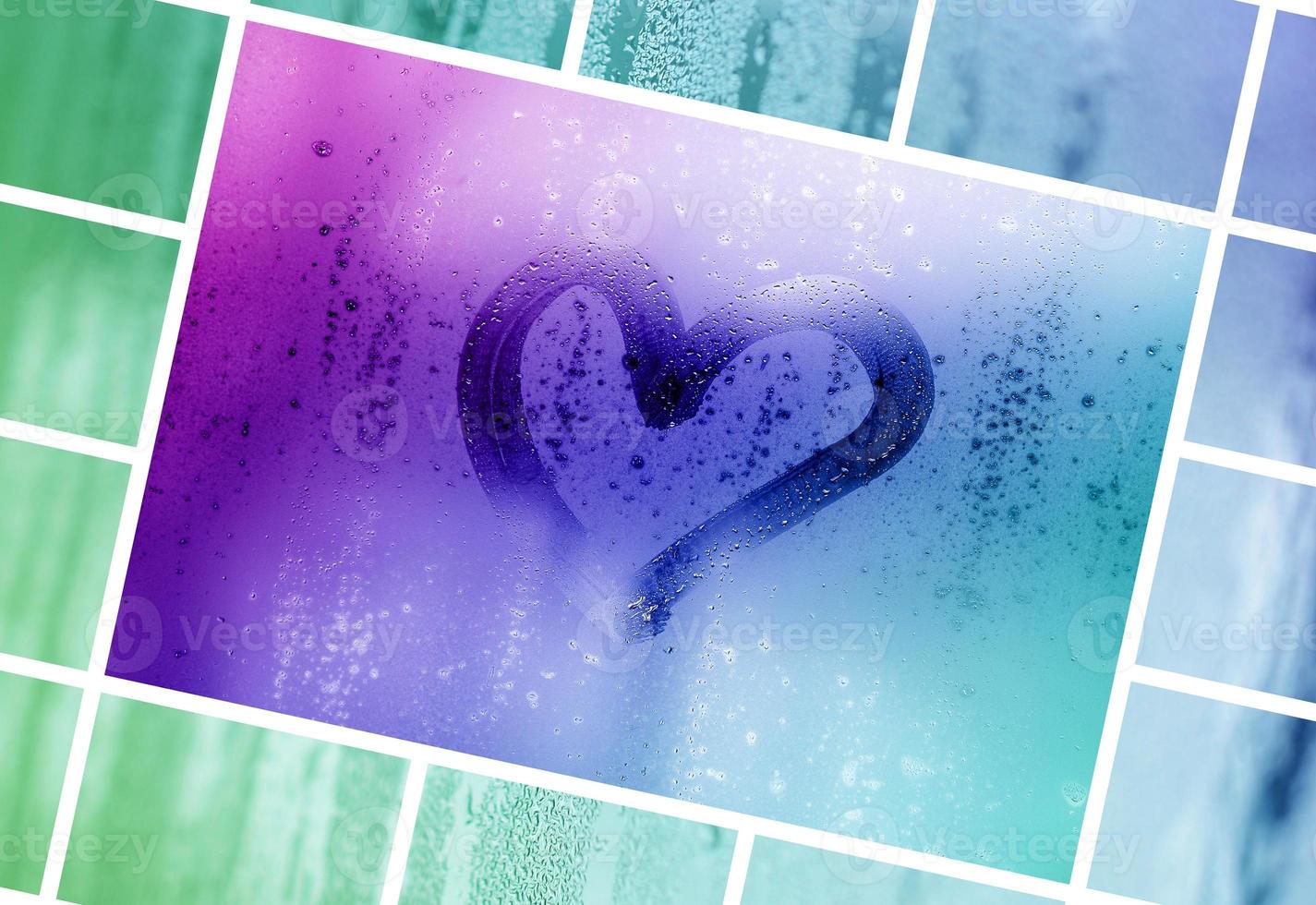 eine Collage aus vielen verschiedenen Glassplittern, verziert mit Regentropfen aus dem Kondensat und bemaltem Herzen in der Mitte foto