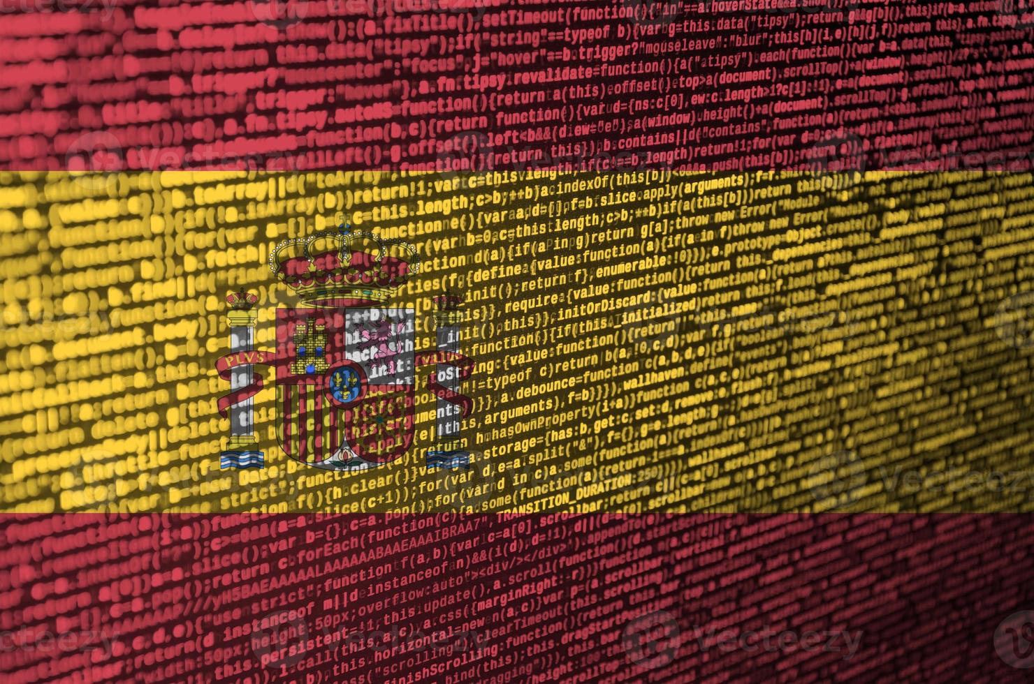 Spanien-Flagge wird auf dem Bildschirm mit dem Programmcode dargestellt. das konzept der modernen technologie und standortentwicklung foto
