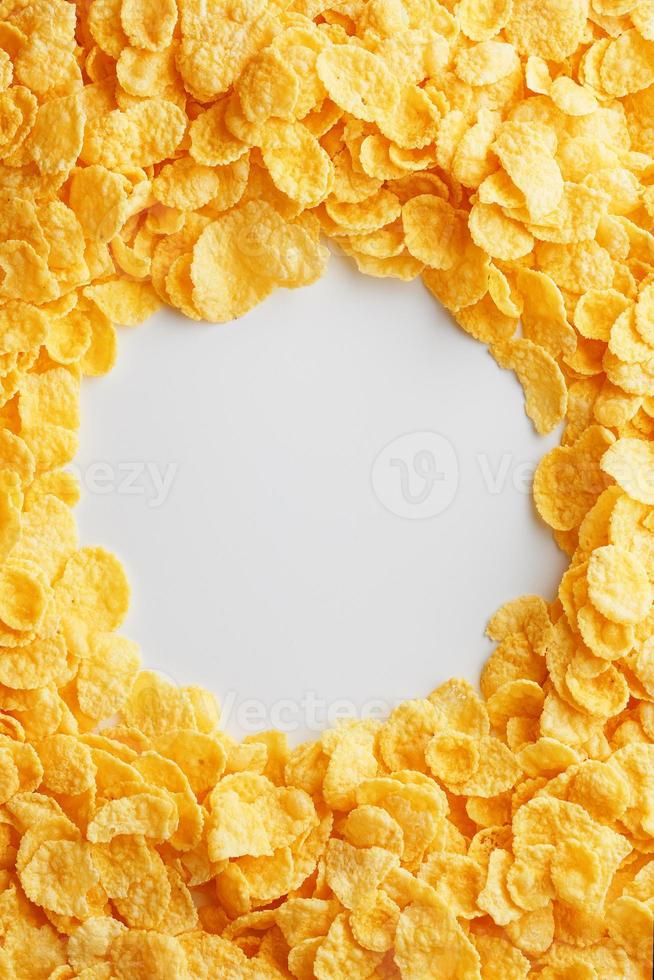 Goldene Cornflakes auf Vollbild mit leerem Leerraum. gesundes Frühstück foto