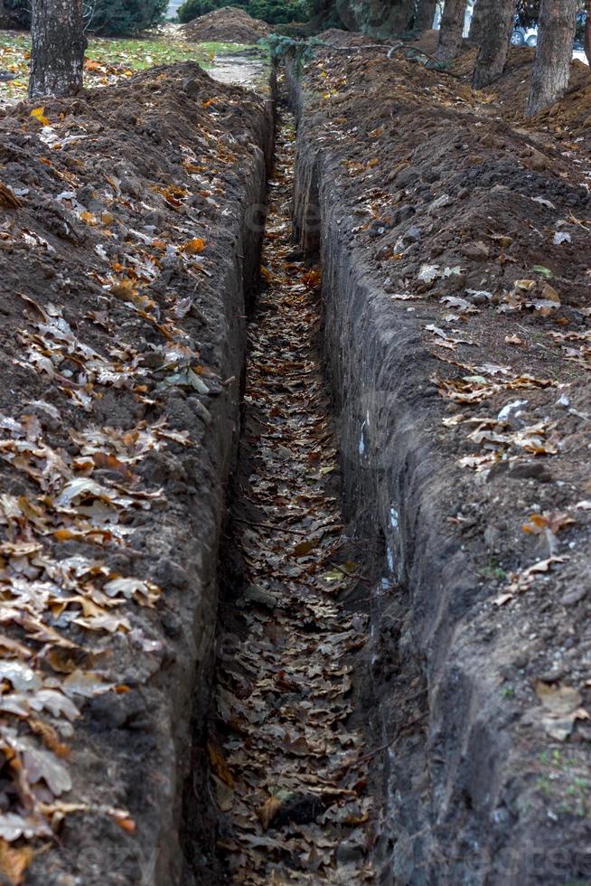 Kabelgraben im Boden, Baustelle foto