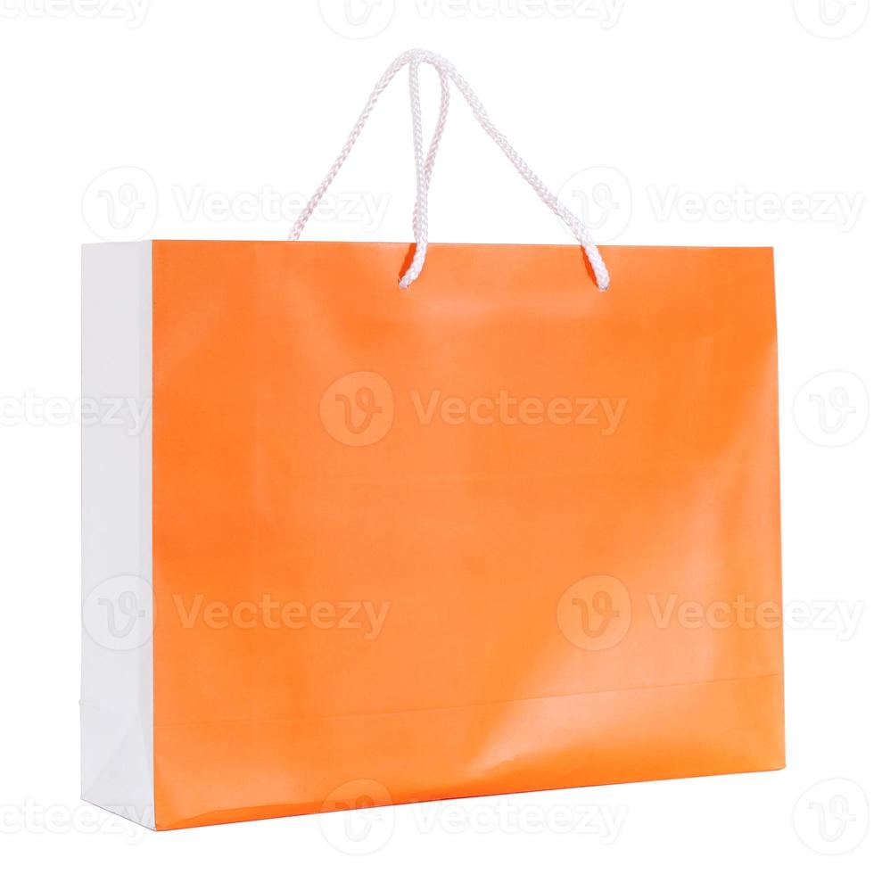 orange Einkaufstüte isoliert auf weiss mit Beschneidungspfad foto
