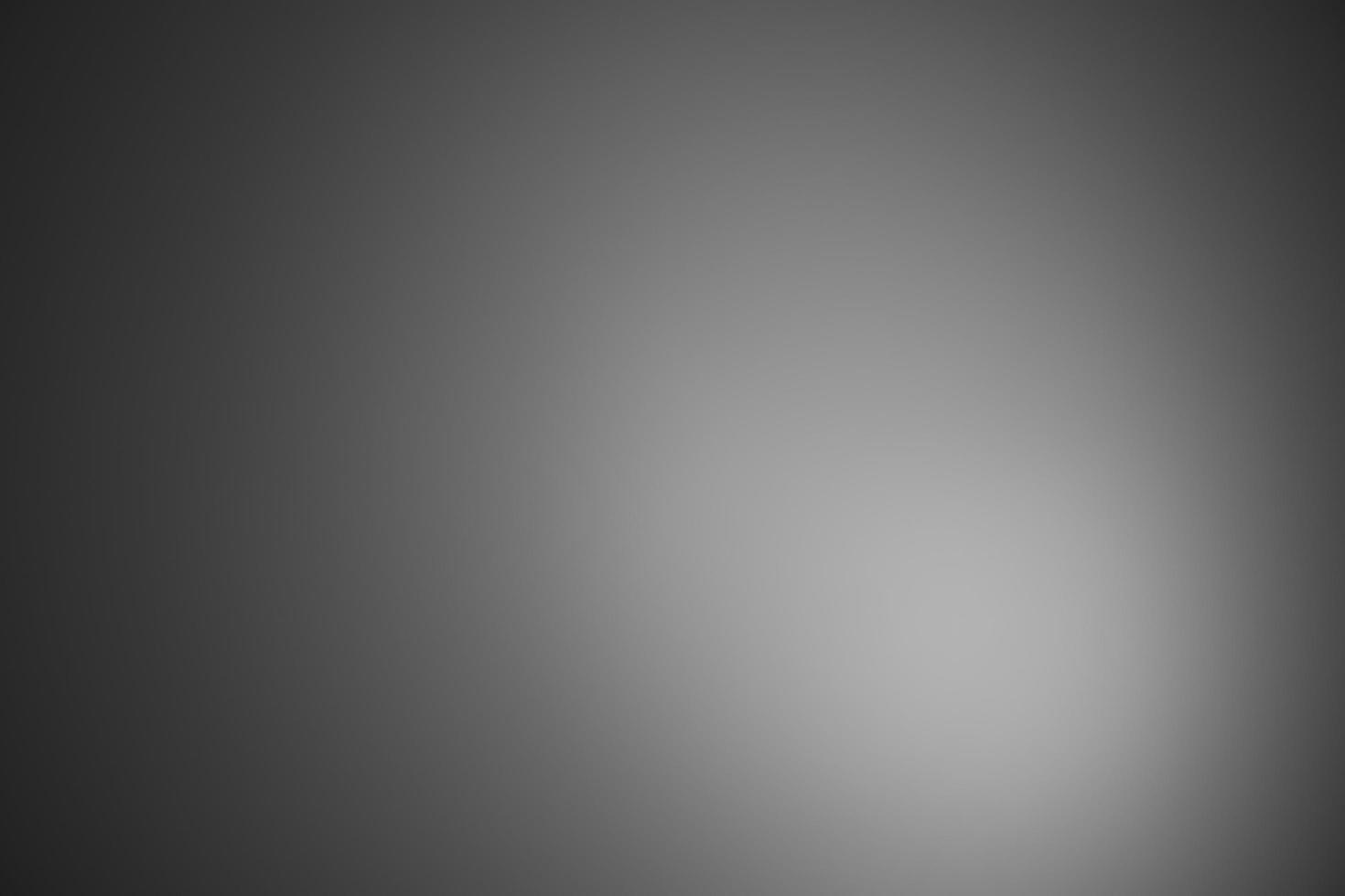 dunkelschwarzer und grauer, unscharfer Hintergrund mit Farbverlauf hat ein wenig abstraktes Licht. weicher hintergrund für tapeten, design, grafik und präsentation, hintergrundwand foto