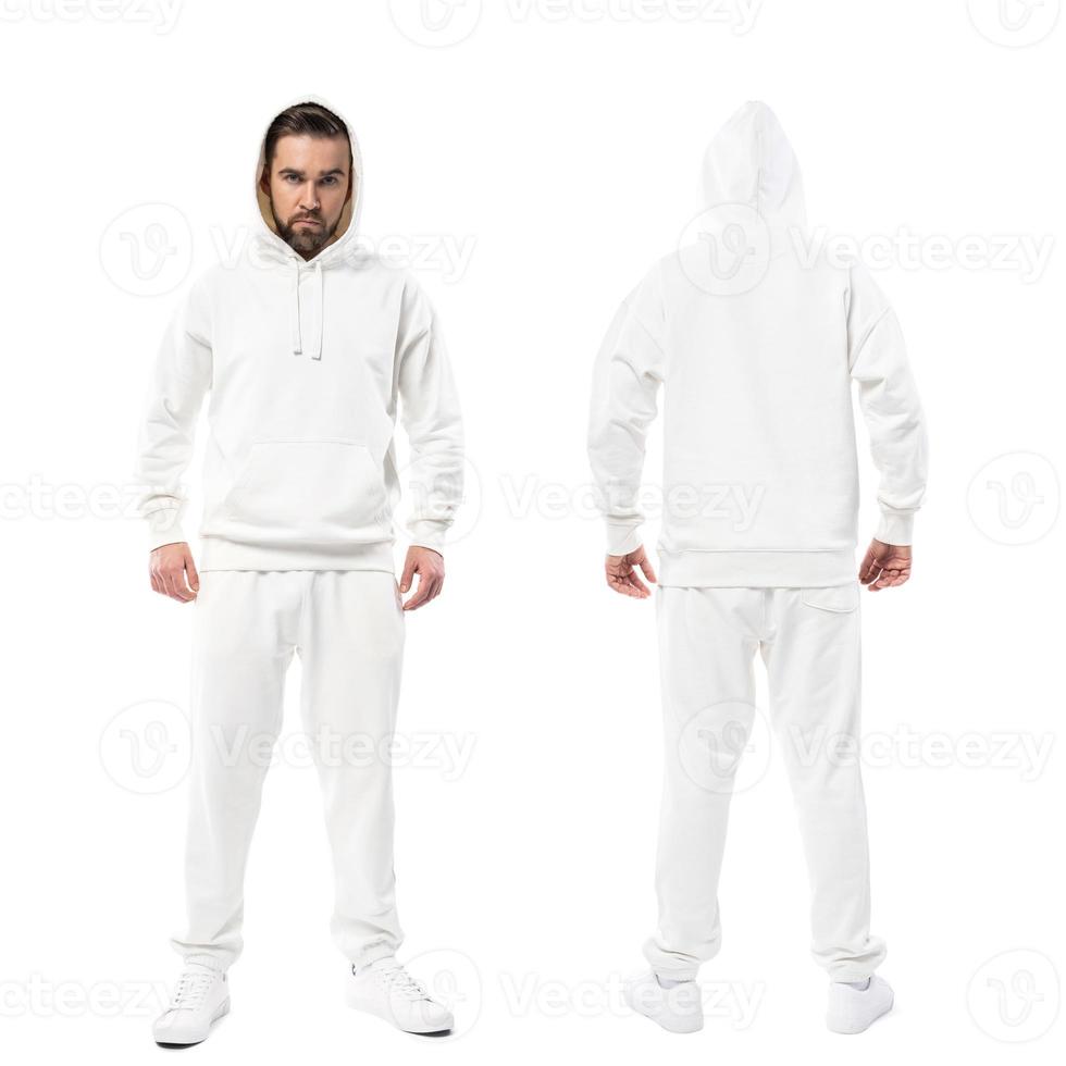 Gutaussehender Mann mit leerem weißen Hoodie und Hose auf weißem Hintergrund foto