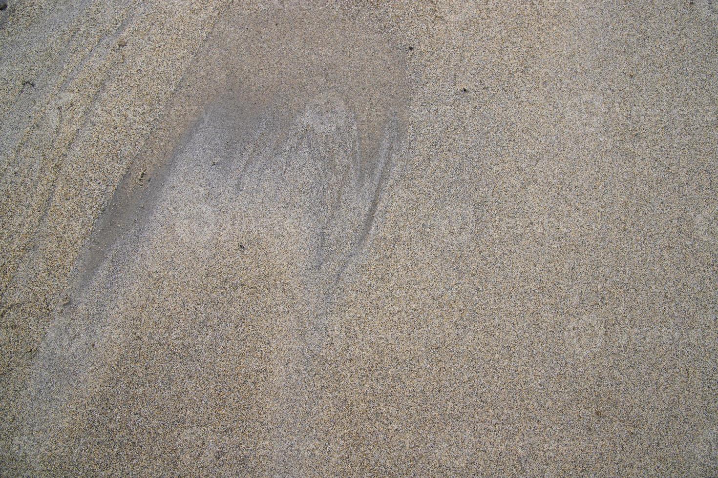 Die von der Natur geschaffene Sandmusterstruktur kann als Hintergrundbild verwendet werden foto