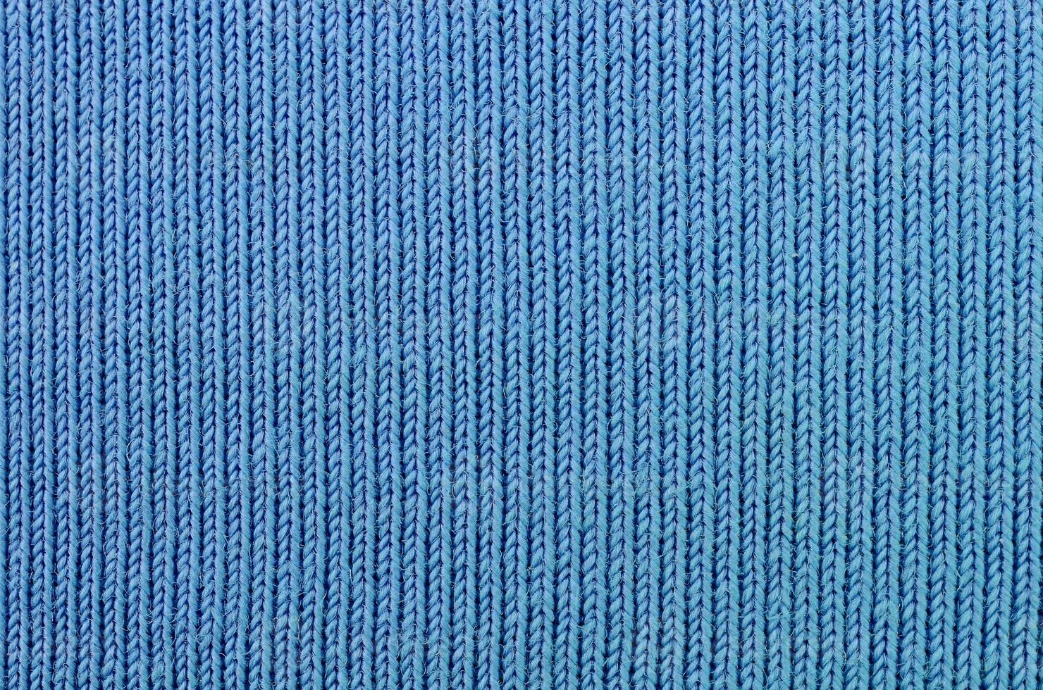 die Textur des Stoffes in blauer Farbe. Stoff zur Herstellung von Hemden und Blusen foto