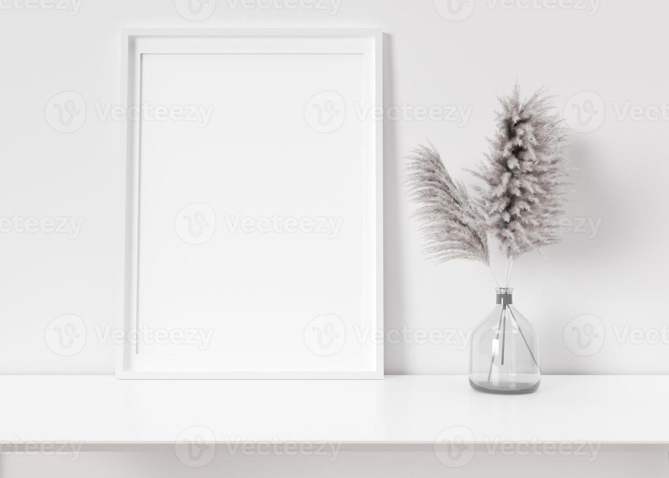 leerer vertikaler bilderrahmen, der auf einem weißen regal steht. Rahmenmodell. kopierraum für bild, poster. Vorlage für Ihr Kunstwerk. Nahaufnahme. Pampasgras in Vase. 3D-Rendering. foto