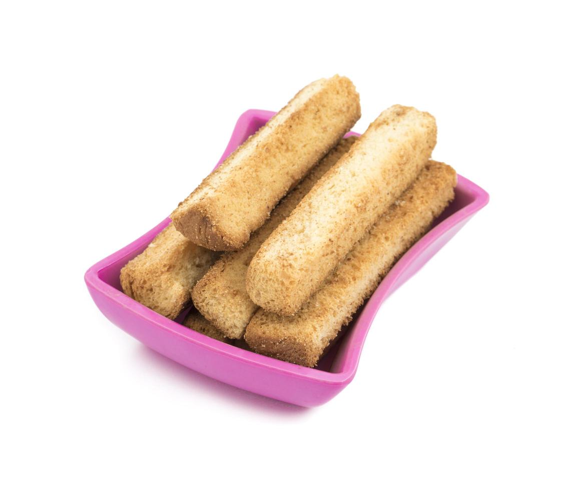 eine rosa Schüssel mit French Toast Sticks foto