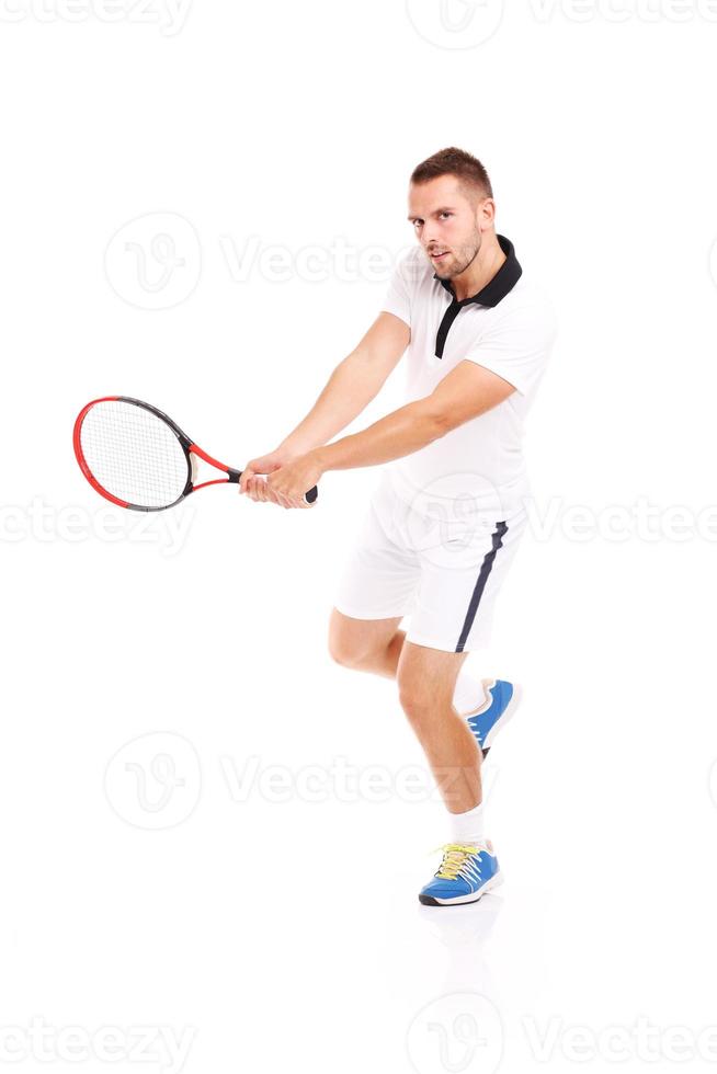 Mann spielt Tennis foto