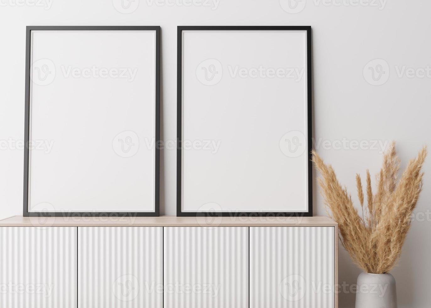 Zwei leere vertikale Bilderrahmen, die auf einem hölzernen Sideboard stehen. Mock-up-Interieur im zeitgenössischen Stil. Freiraum für Bild, Poster. Konsole, Vase mit Pampasgras. 3D-Rendering. foto
