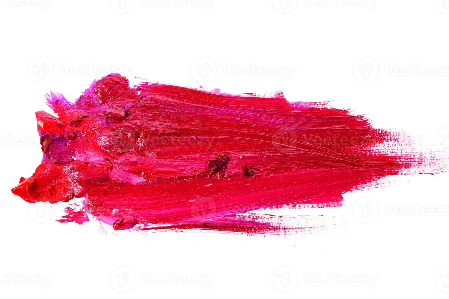 verschmierter roter Lippenstift auf dem weißen Hintergrund foto