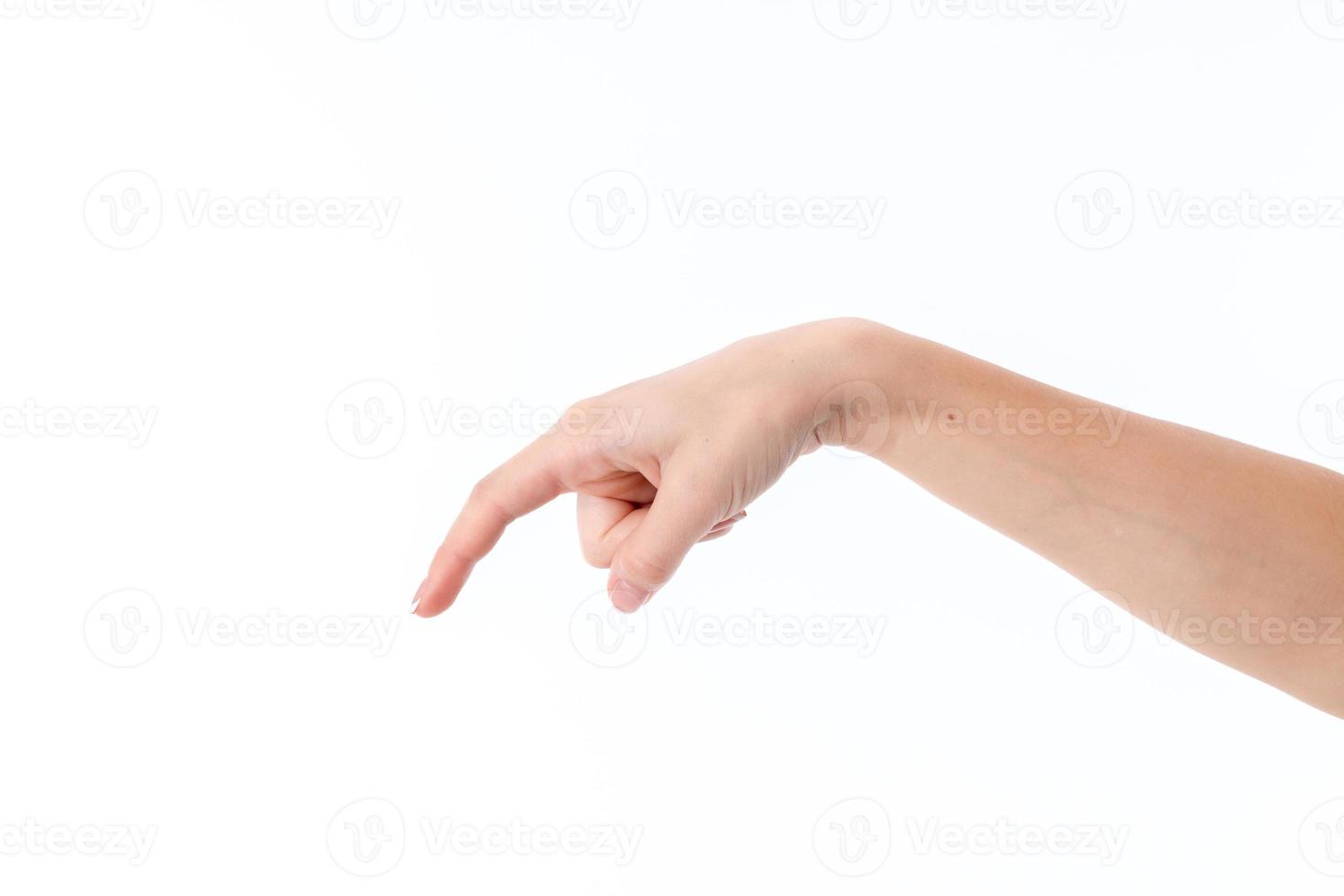 weibliche Hand mit abgesenkten Handflächen und Zeigefinger isoliert auf weißem Hintergrund foto