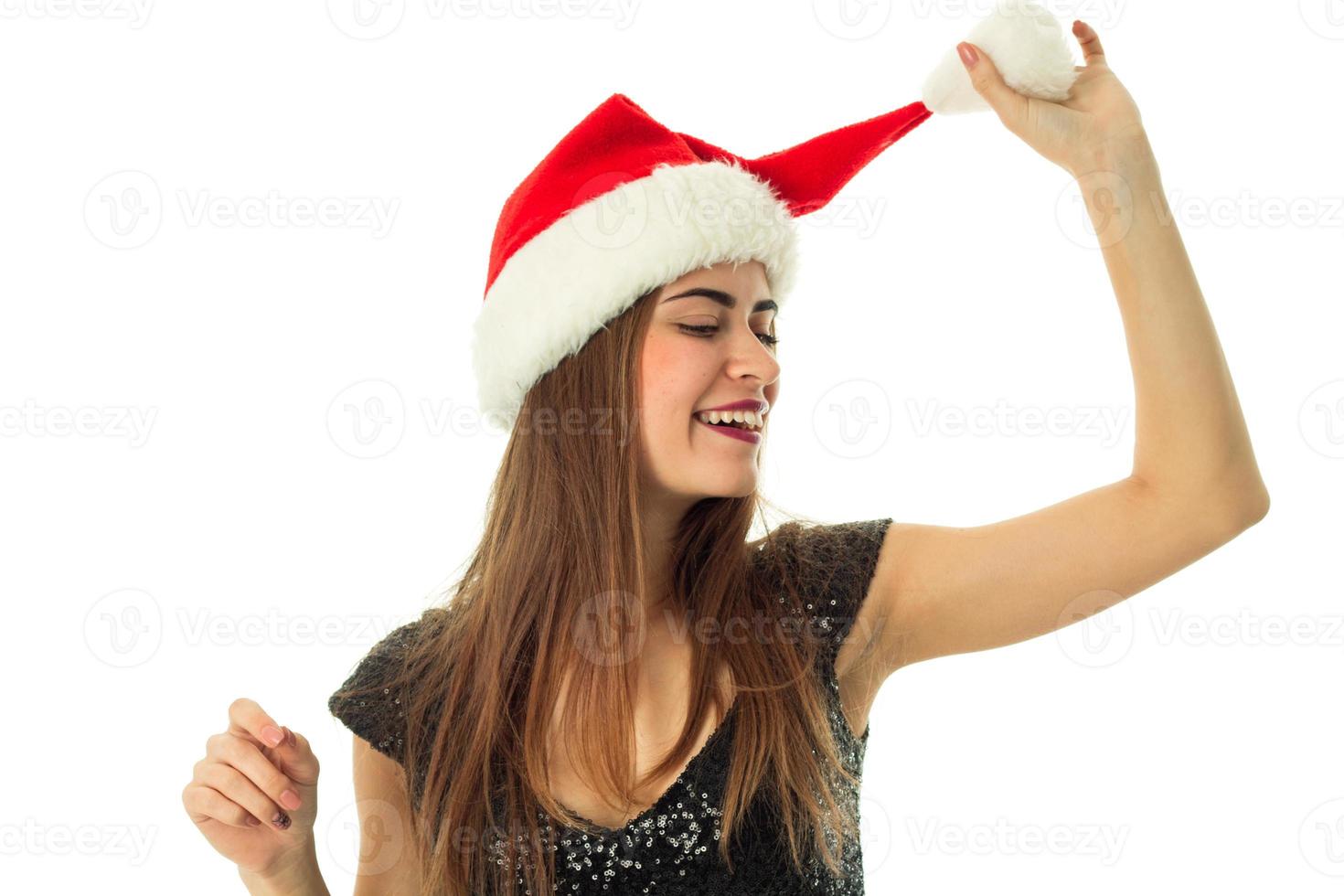 Porträt einer glücklichen Frau mit Weihnachtsmütze foto