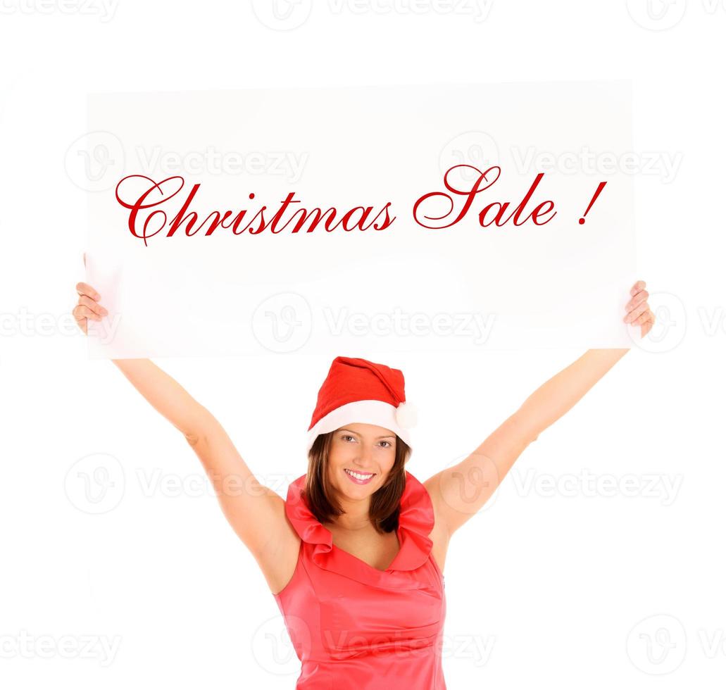 Frau mit Weihnachtsmütze zu Weihnachten foto