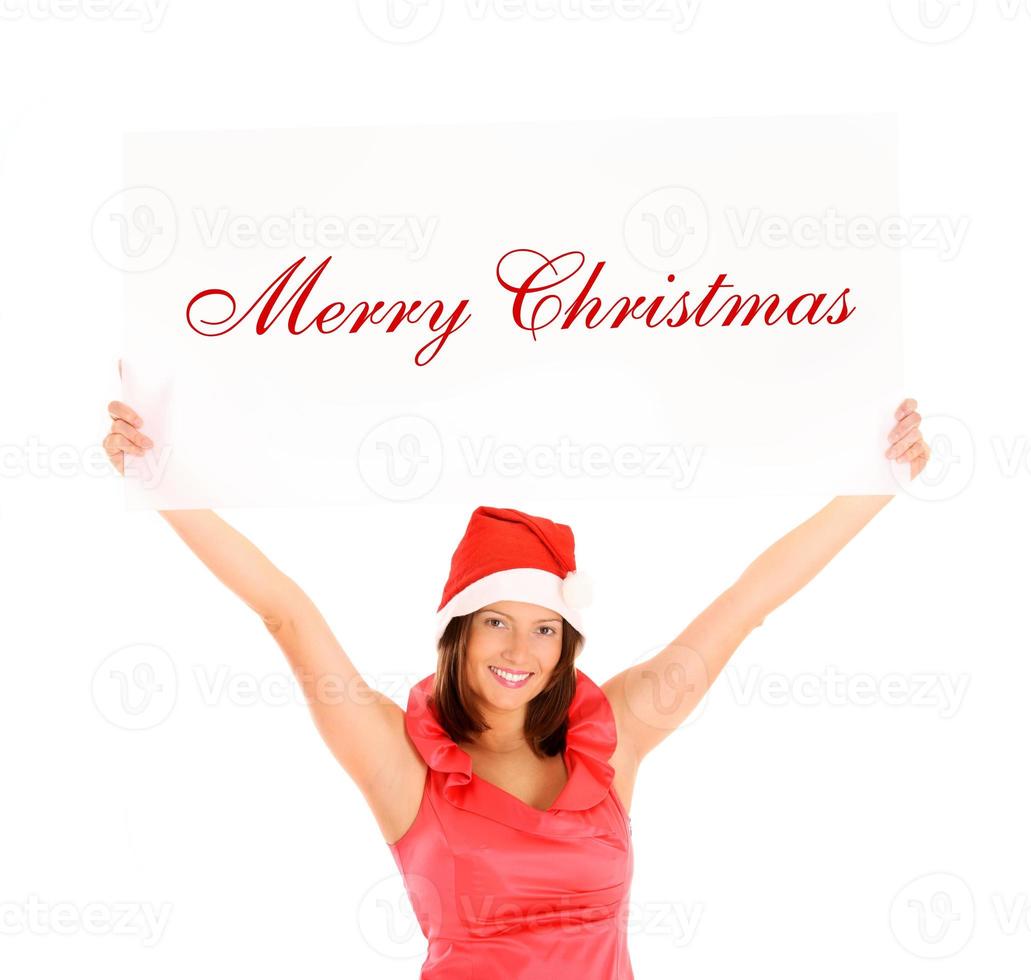 Frau mit Weihnachtsmütze zu Weihnachten foto