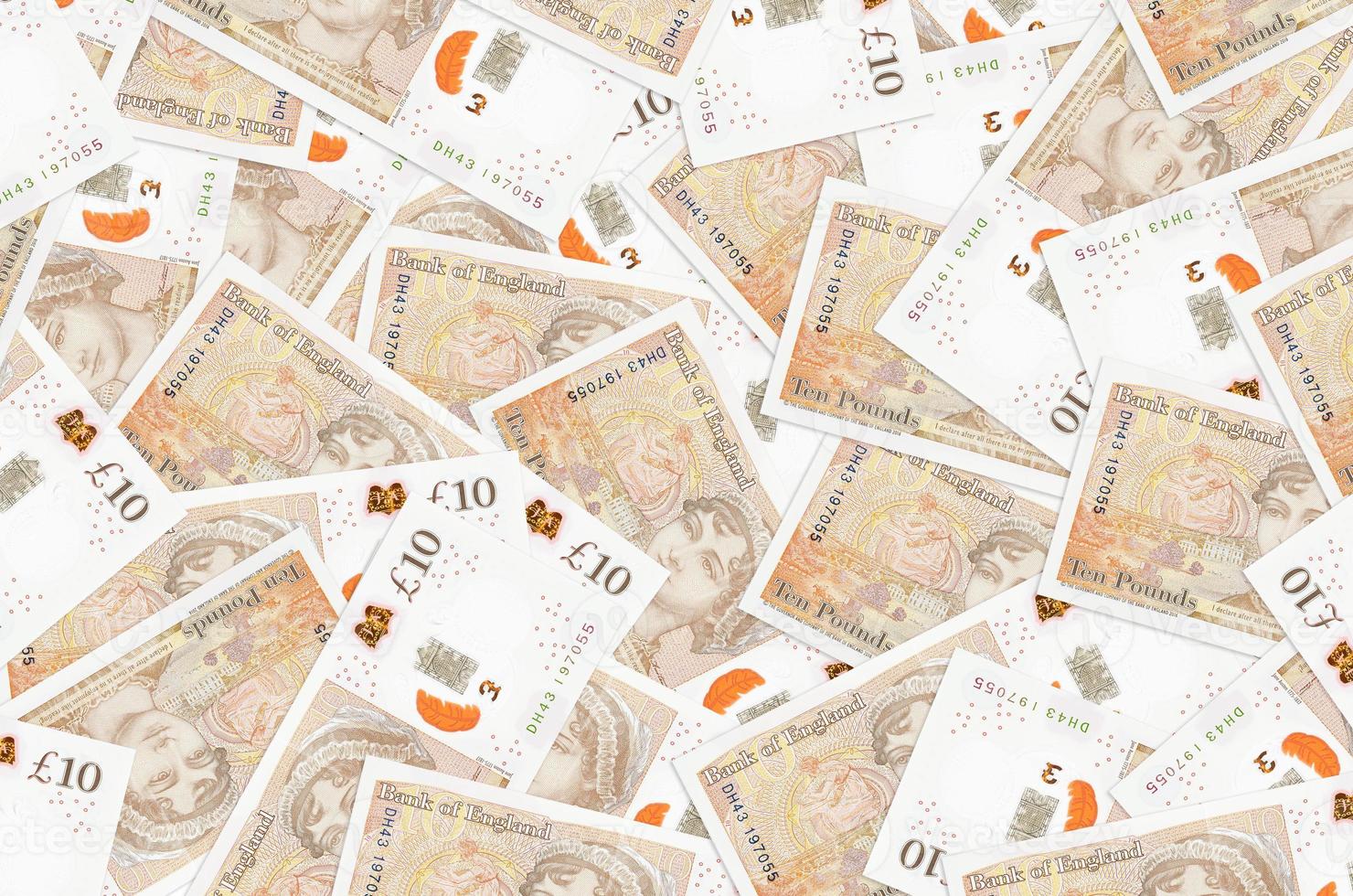 10 britische Pfund-Scheine liegen in einem großen Haufen. konzeptioneller hintergrund des reichen lebens foto